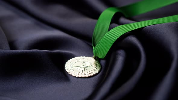 Silver Medal with Ribbon on Black Background Closeup