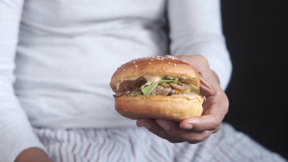 Hungry Man Waiting for Eating Beef Burger on Table Close Up