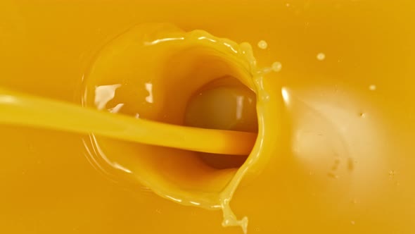 Super Slow Motion Shot of Pouring Orange Juice at 1000Fps