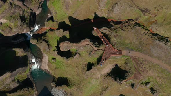 Overhead View Over Fjadrargljufur Canyon Viewpoint with Tourists Watching Amazing Panorama and