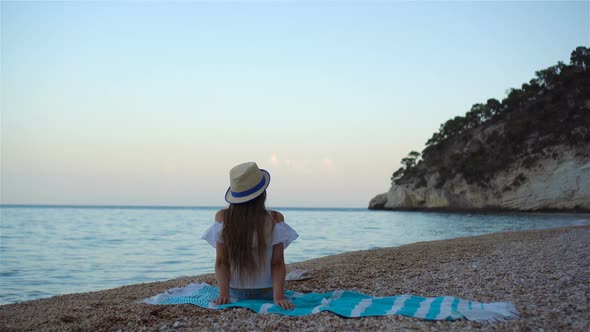 Cute Little Girl at Beach During Summer Vacation