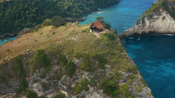 Aerial shot of a house on a cliff. Nusa Penida Island.