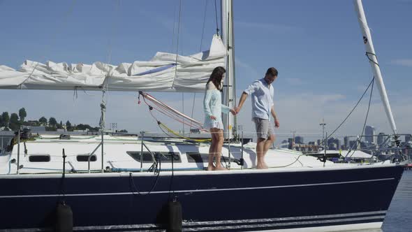 Young couple on sailboat together. Shot on RED EPIC for high quality 4K, UHD, Ultra HD resolution.