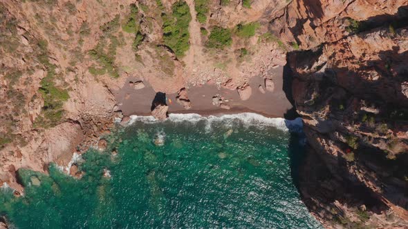 Aerial Top View of Red Sand Beach Waves Crushing on the Beach