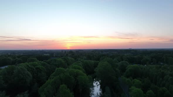 dropping down from a sunset to a Dutch canal