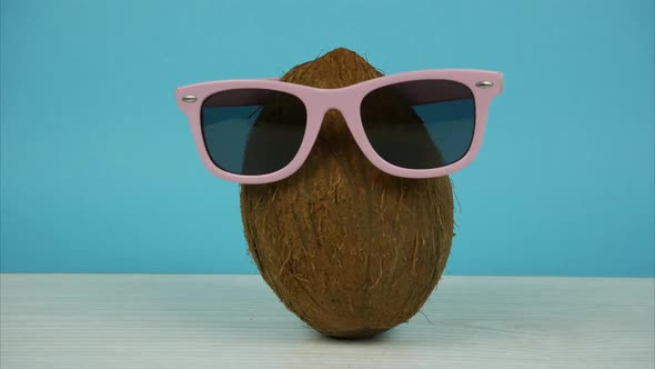 Coconut in Sunglasses and a Cap Symbolizing a Summer Vacation. Stop Motion Animation