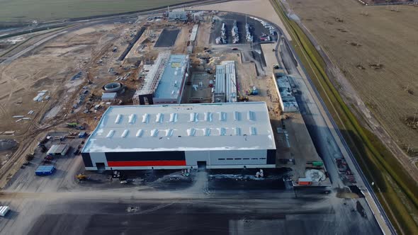 Aerial View of Over a New Constructions Development Site Warehouses Projects and Heavy Machinery and