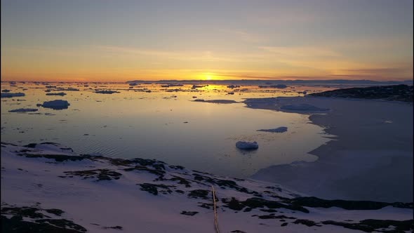 Ice And Snow In Sea Of Ilulissat Icefjord At Sunset