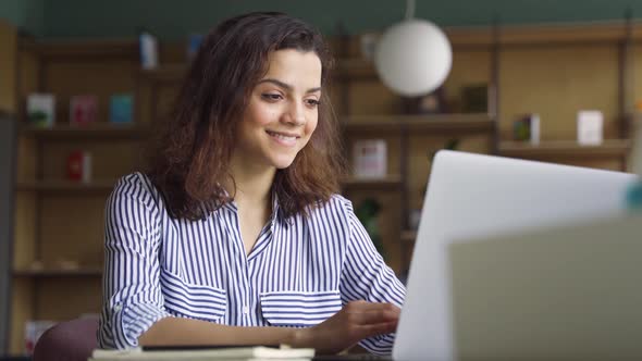 Happy Latin Girl Student Using Laptop Watching Distance Online Seminar Class