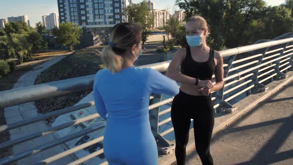 Fit Urban Runners Meeting on Bridge During Workout