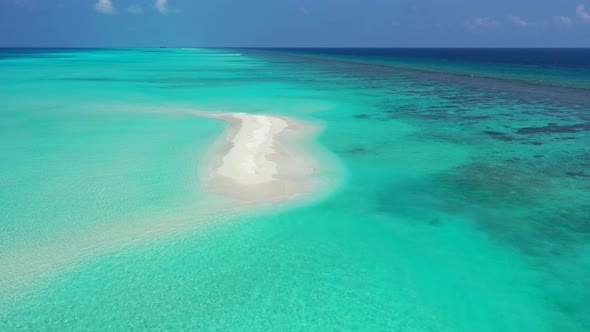 Natural drone copy space shot of a sandy white paradise beach and turquoise sea background in colour