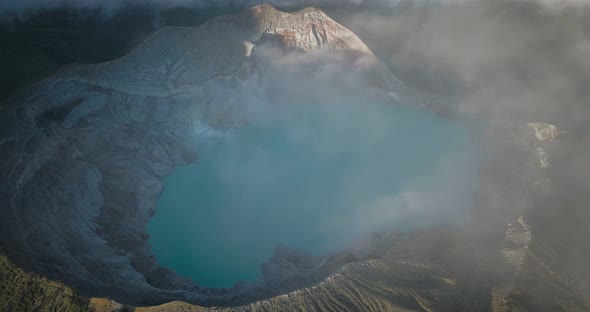 Panoramic view at East Java, Indonesia. Aerial view of rock cliff at Kawah Ijen volcano with turquoi