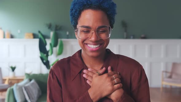 Young Happy African American Woman Laugh Sincerely Putting Hands to Chest