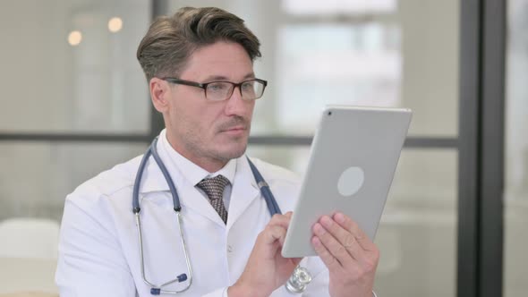 Portrait of Doctor using Digital Tablet