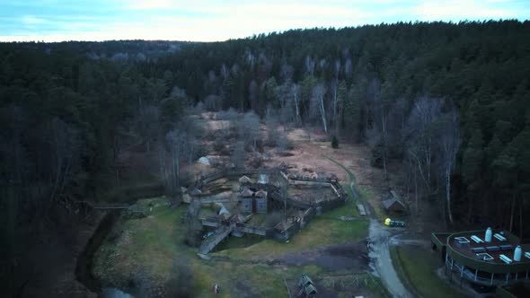 Park in Forest With Wooden Statues of Gnomes, Monsters.  Aerial View of the Wooden Castle 4K Video