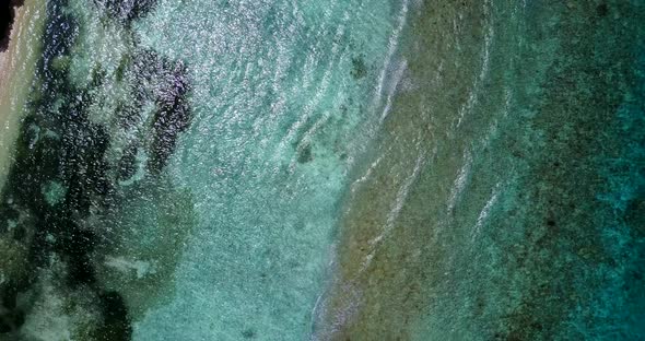 Beautiful birds eye abstract shot of a summer white paradise sand beach and blue ocean background in