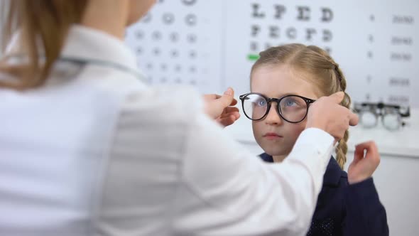 Capricious Schoolgirl Rejecting Glasses, Dissatisfied With Eyewear Design