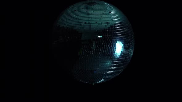 Disco Mirror Ball at Black Background with Glares