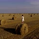 Beautiful Girl On Hay Bales Enjoys the Summer - VideoHive Item for Sale