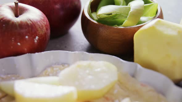 Slice of apple on tart with icing sugar 4k