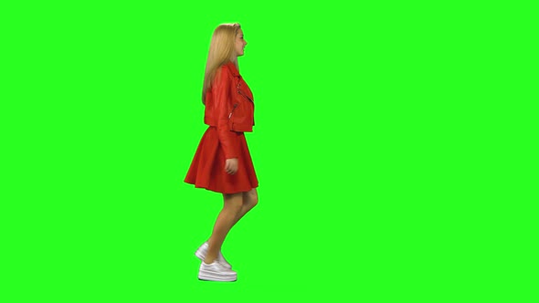 Blonde Girl Is Running To a Meeting with Lovely Smile at Green Screen Background. Chroma Key, Shot
