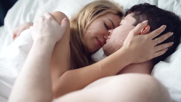 Sensual Couple Embracing in Bed