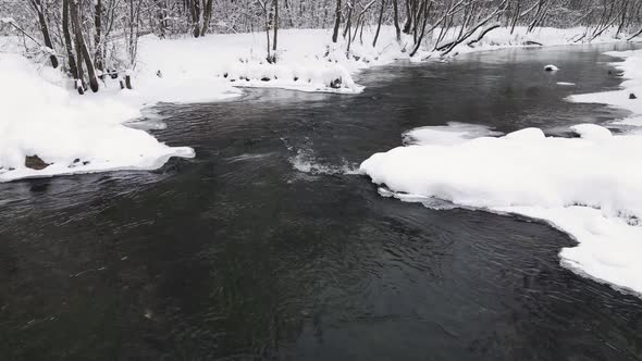 Fantastic Winter Landscape with an Icefree River Aerial View