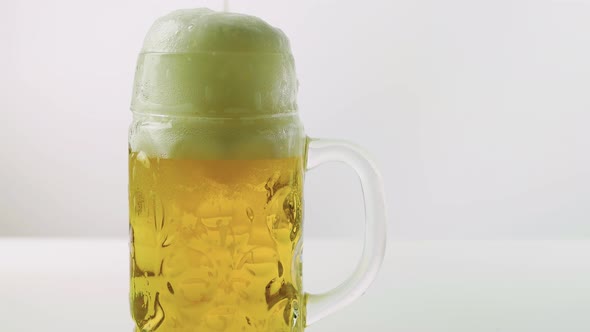 Glass Of Beer On A White Background, Foamy Beer In A Glass, Close Up Of Draft Beer.