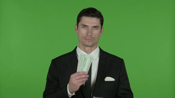 Young Businessman Showing Money in Hand, Chroma Key