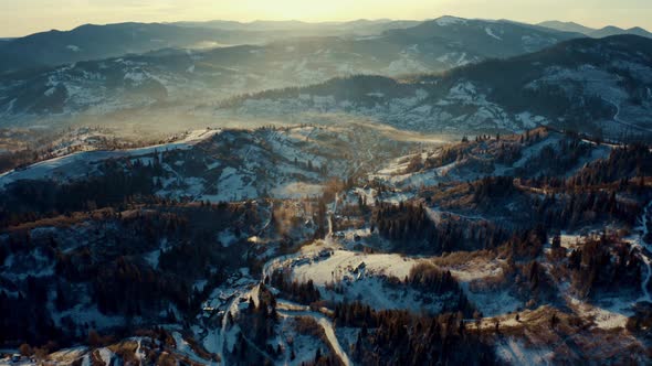 Aerial View of the Village in Winter Mountains, Sunrise in Winter Carpathian Mountains, Aerial View