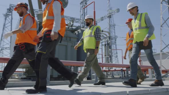 Engineers Inspecting Modern Power Plant