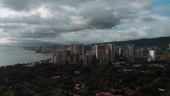 Aerial drone footage of Honolulu, Hawaii. Beautiful real estate, buildings in the city. Palm trees