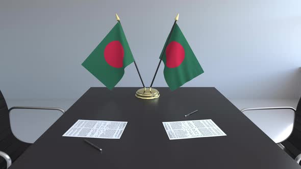 Flags of Bangladesh and Papers on the Table