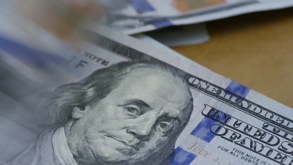 Rotating stock footage shot of $100 bills