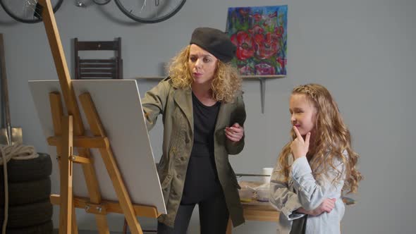 Artist Teaches Girl To Draw on Canvas