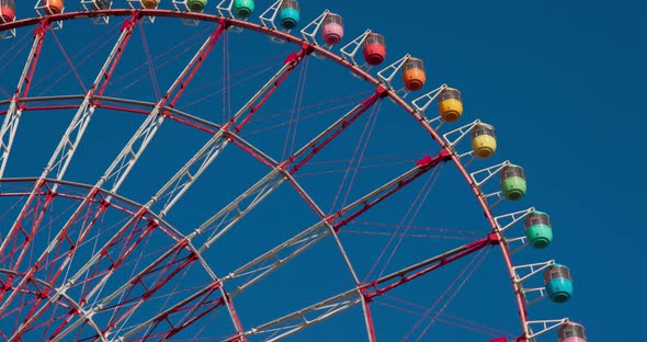 Ferris wheel over blue sky