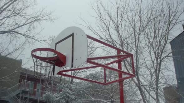 Basketball Net Covered with Snow