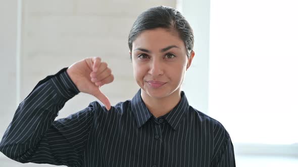 Young Indian Woman Doing Thumbs Down 