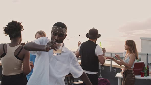 African-American Man Dancing at Rooftop Party