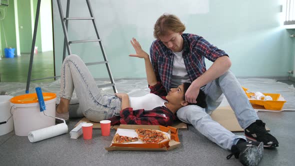 Couple Discussing Interior Design of New House