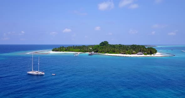 Beautiful drone copy space shot of a white sandy paradise beach and turquoise sea background in vibr