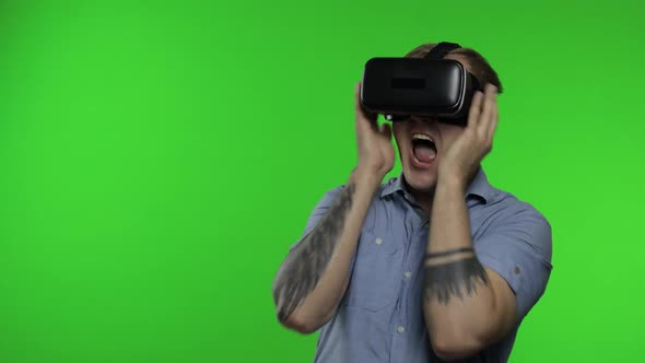 Man Using VR App Helmet To Play Simulation Game, Drawing. Guy Watching Virtual Reality 3d Video