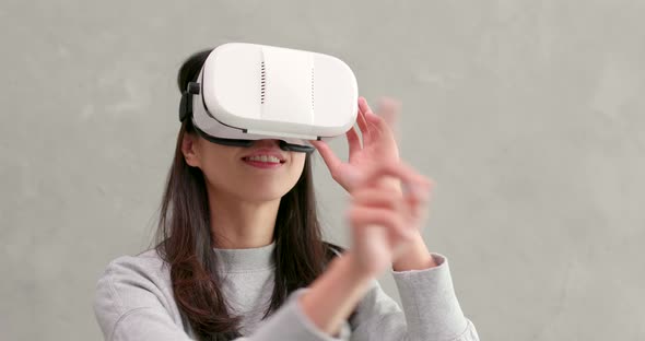 Woman playing game with VR device