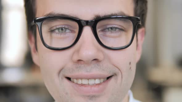 Close Up of Smiling Man Face in Glasses