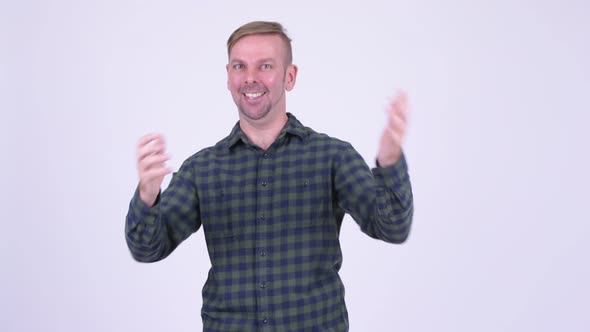 Portrait of Happy Blonde Hipster Man with Surprise Gesture