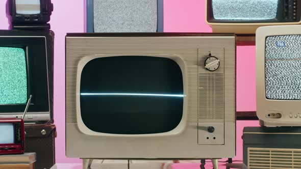 Old Televisions with Grey Interference Screen on Pink Red Neon Background