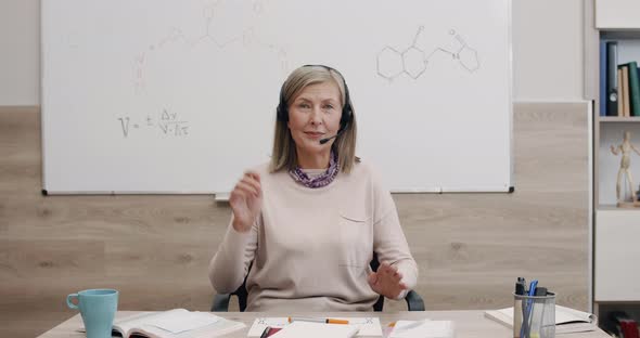 Crop View of Senior Cheerful Woman Talking and Gesturing While Looking To Camera