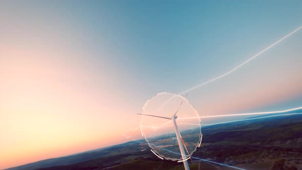 Fpv Drone shot of digital lines connecting wind turbine outdoors on rural landscape during sunset -