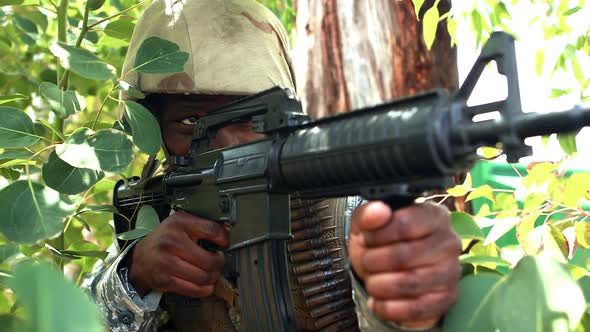 Military soldier guarding with a rifle