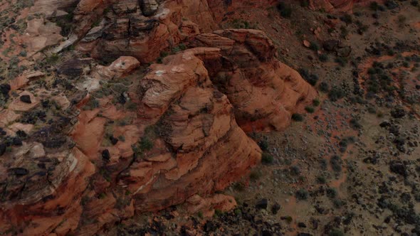 Aerial Drone footage of the mountainous red rocks in southern Utah. Showing the sky, the mountains,